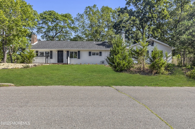 1822 Deerhead Lake Dr, Forked River, NJ 08731 - view of front facade featuring a front lawn, stucco siding, and a chimney