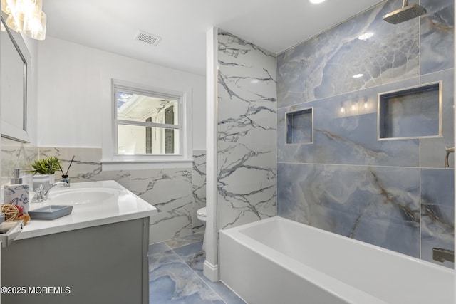1822 Deerhead Lake Dr, Forked River, NJ 08731 - full bath with marble tiled flooring, vanity, tile walls, and shower / bath combination
