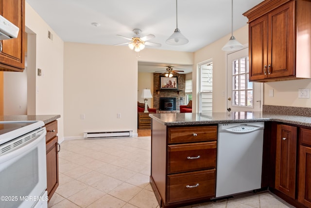 16 Saint Paul Pl, Manchester, NJ 08759 - kitchen featuring white appliances, a baseboard radiator, a ceiling fan, a peninsula, and a brick fireplace