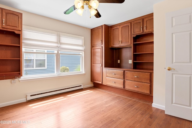 16 Saint Paul Pl, Manchester, NJ 08759 - unfurnished bedroom featuring baseboard heating, light wood-type flooring, and a ceiling fan