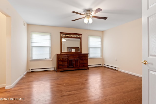 16 Saint Paul Pl, Manchester, NJ 08759 - spare room with a baseboard heating unit, a ceiling fan, and light wood-style flooring