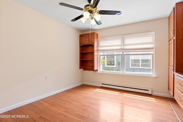 16 Saint Paul Pl, Manchester, NJ 08759 - spare room featuring a baseboard heating unit, light wood-style floors, and ceiling fan