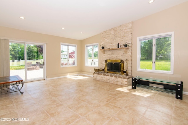 67-69 School Rd E, Marlboro, NJ 07746 - unfurnished living room with lofted ceiling, recessed lighting, a fireplace, and light tile patterned floors