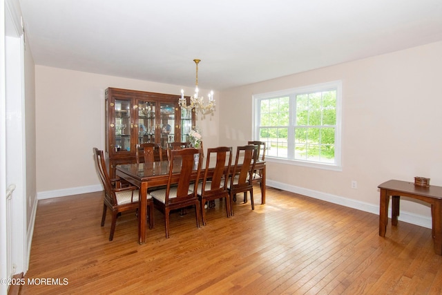 67-69 School Rd E, Marlboro, NJ 07746 - dining room with a chandelier and light wood-style flooring