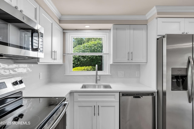 377 Old Nassau Rd Unit 377B, Monroe, NJ 08831 - kitchen featuring appliances with stainless steel finishes, crown molding, backsplash, light countertops, and white cabinets