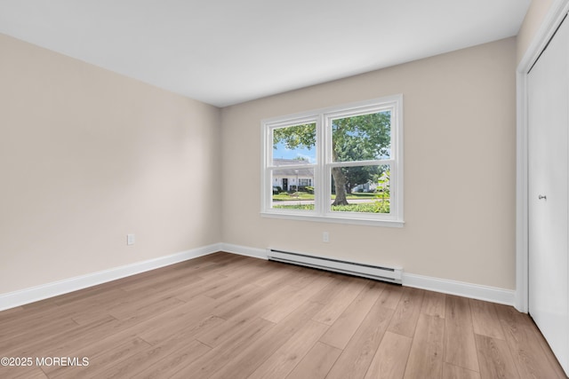 377 Old Nassau Rd Unit 377B, Monroe, NJ 08831 - spare room with a baseboard radiator and light wood-style flooring