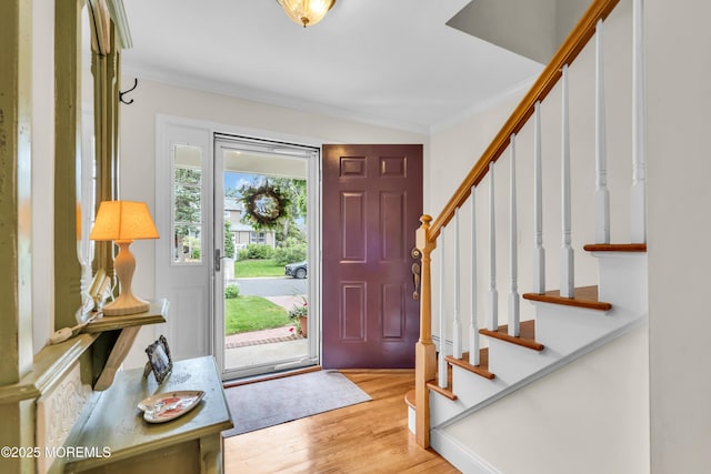 217 Howe St, Point Pleasant, NJ 08742 - entrance foyer with crown molding, stairway, and wood finished floors
