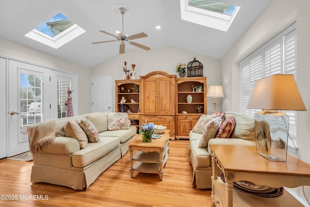 217 Howe St, Point Pleasant, NJ 08742 - living room with a skylight, light wood-style flooring, a ceiling fan, vaulted ceiling, and recessed lighting
