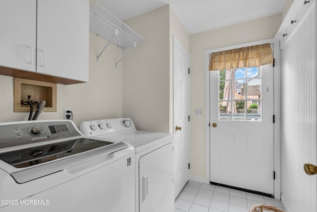 217 Howe St, Point Pleasant, NJ 08742 - laundry area featuring cabinet space, washer and clothes dryer, and light tile patterned flooring