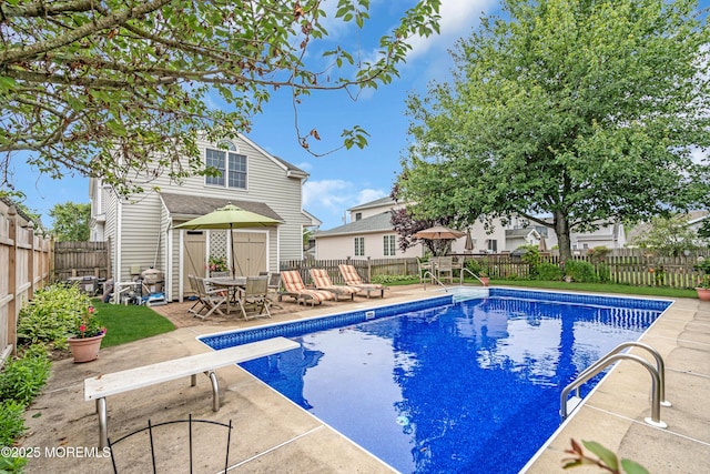 217 Howe St, Point Pleasant, NJ 08742 - view of pool with a diving board, a patio, a fenced backyard, and outdoor dining area