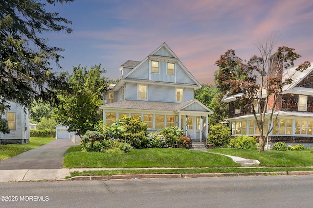 104 S St, Eatontown, NJ 07724 - view of front of house featuring an outbuilding, a yard, a garage, and a shingled roof