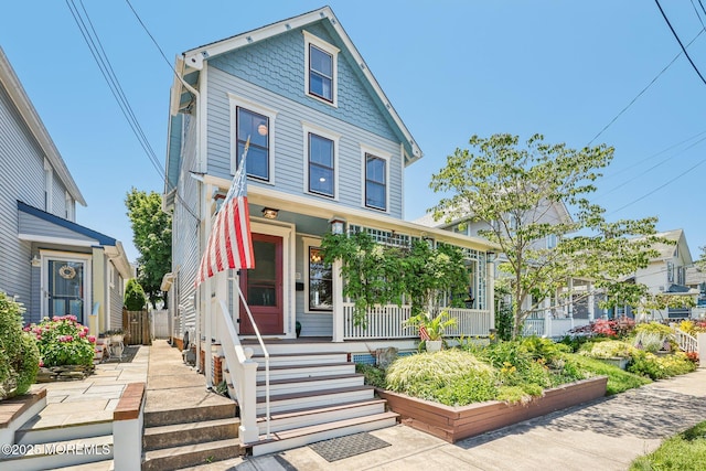 132 Cookman Ave, Ocean Grove, NJ 07756 - victorian home featuring a porch