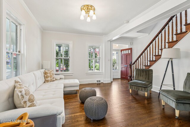 132 Cookman Ave, Ocean Grove, NJ 07756 - living room with wood finished floors, a chandelier, stairs, and ornamental molding