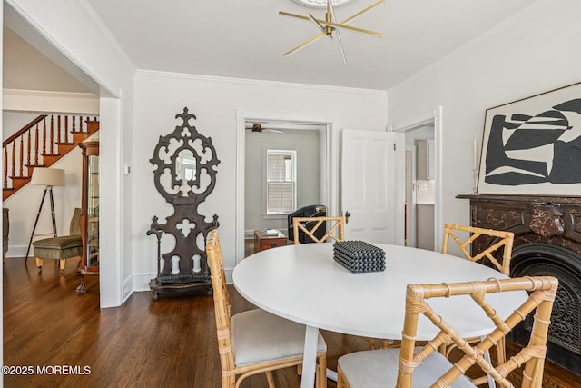 132 Cookman Ave, Ocean Grove, NJ 07756 - dining room featuring dark wood finished floors, ornamental molding, stairway, and a ceiling fan