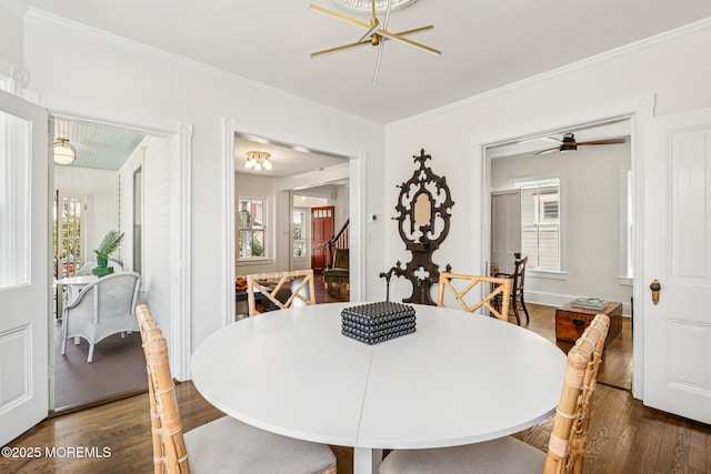 132 Cookman Ave, Ocean Grove, NJ 07756 - dining space featuring dark wood-type flooring, healthy amount of natural light, crown molding, stairs, and a chandelier