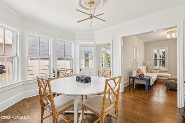 132 Cookman Ave, Ocean Grove, NJ 07756 - dining area with healthy amount of natural light, dark wood-style flooring, crown molding, and a chandelier