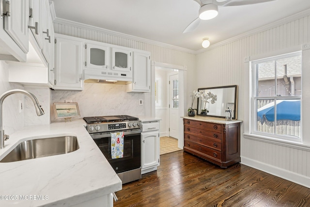 132 Cookman Ave, Ocean Grove, NJ 07756 - kitchen featuring stainless steel gas range oven, under cabinet range hood, ornamental molding, dark wood finished floors, and white cabinets