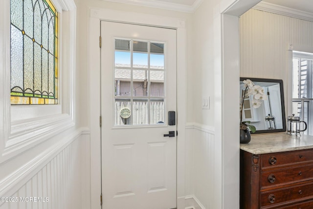 132 Cookman Ave, Ocean Grove, NJ 07756 - doorway with ornamental molding, a decorative wall, and a wainscoted wall