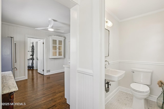 132 Cookman Ave, Ocean Grove, NJ 07756 - half bath with crown molding, wood finished floors, and ceiling fan