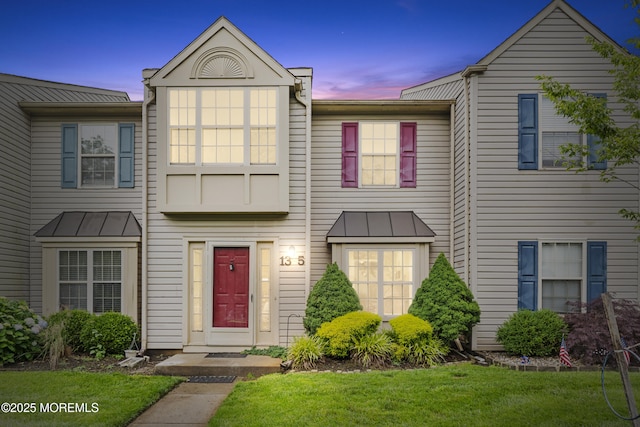 13 Stuart Dr Unit 5, Freehold, NJ 07728 - view of property featuring a standing seam roof, a lawn, and a metal roof