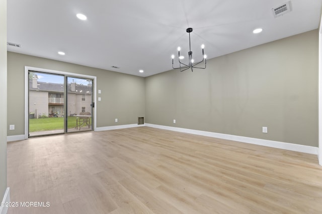 13 Stuart Dr Unit 5, Freehold, NJ 07728 - spare room featuring light wood-style floors, recessed lighting, and a chandelier