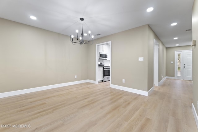 13 Stuart Dr Unit 5, Freehold, NJ 07728 - unfurnished dining area with a chandelier, light wood-style floors, and recessed lighting