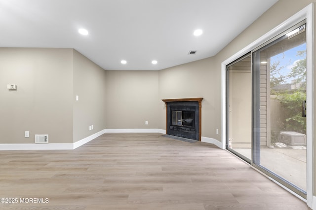 13 Stuart Dr Unit 5, Freehold, NJ 07728 - unfurnished living room with recessed lighting, light wood-style floors, and a fireplace with flush hearth