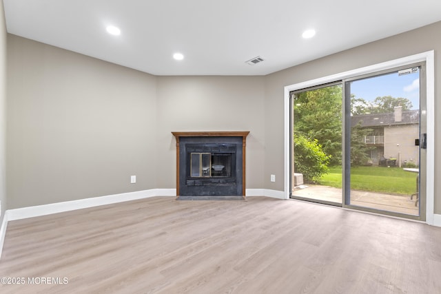 13 Stuart Dr Unit 5, Freehold, NJ 07728 - unfurnished living room featuring light wood finished floors, recessed lighting, and a fireplace with flush hearth