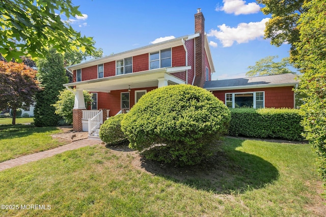 217 Alpern Ave, Elberon, NJ 07740 - view of front of home featuring a chimney, a front lawn, and a porch