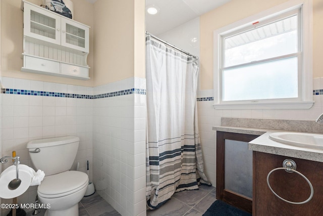 217 Alpern Ave, Elberon, NJ 07740 - full bathroom featuring tile walls, wainscoting, vanity, and a shower with shower curtain