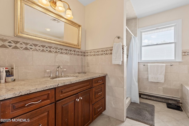 217 Alpern Ave, Elberon, NJ 07740 - full bath featuring tile walls, vanity, a shower stall, tile patterned flooring, and wainscoting