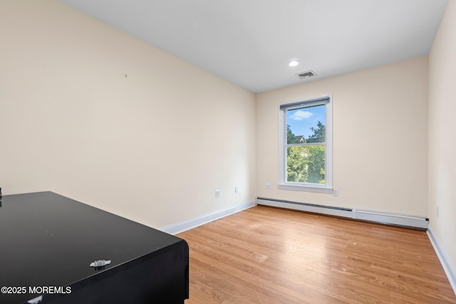 217 Alpern Ave, Elberon, NJ 07740 - unfurnished room featuring a baseboard radiator, light wood-style floors, and recessed lighting