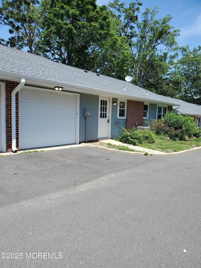 482C Thornbury Ct, Lakewood, NJ 08701 - single story home with a garage, driveway, brick siding, and roof with shingles