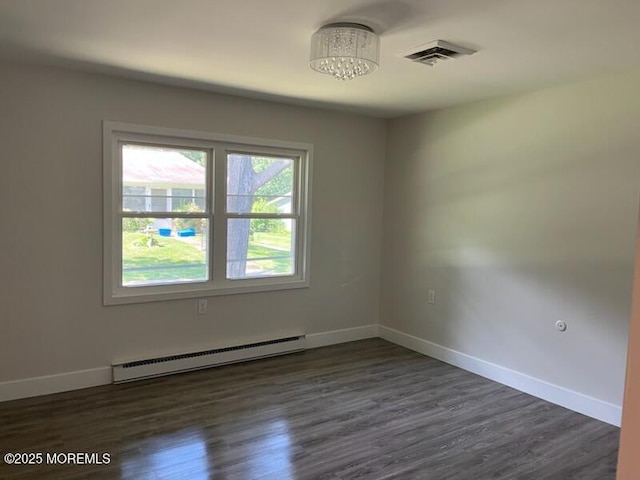 482C Thornbury Ct, Lakewood, NJ 08701 - unfurnished room with a baseboard heating unit, plenty of natural light, dark wood-style floors, and a chandelier