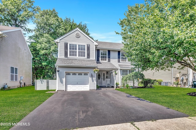 27 Skyline Dr, Hazlet, NJ 07730 - traditional-style house featuring an attached garage, driveway, and a shingled roof