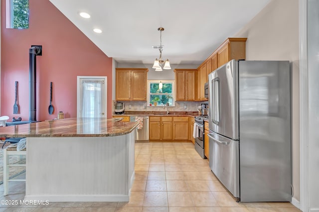 27 Skyline Dr, Hazlet, NJ 07730 - kitchen featuring stainless steel appliances, dark stone countertops, backsplash, a kitchen island, and recessed lighting