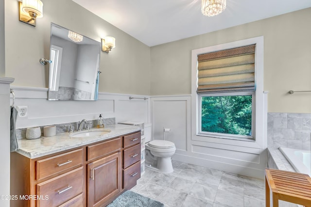 27 Skyline Dr, Hazlet, NJ 07730 - full bath with a wainscoted wall, vanity, a garden tub, and plenty of natural light