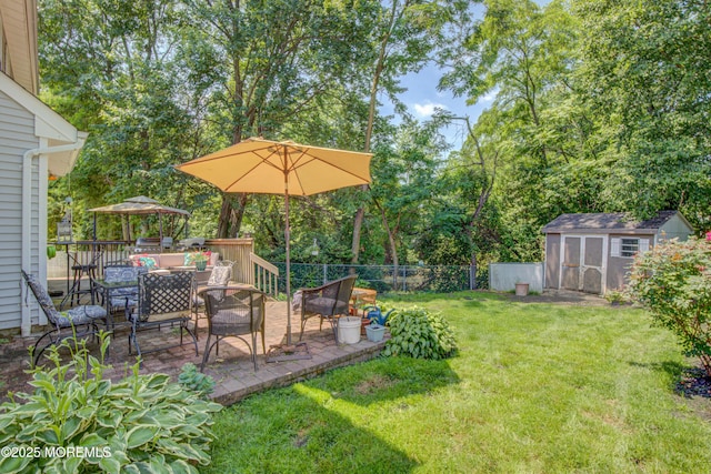 27 Skyline Dr, Hazlet, NJ 07730 - view of yard with a storage shed, a patio area, view of wooded area, and outdoor dining space