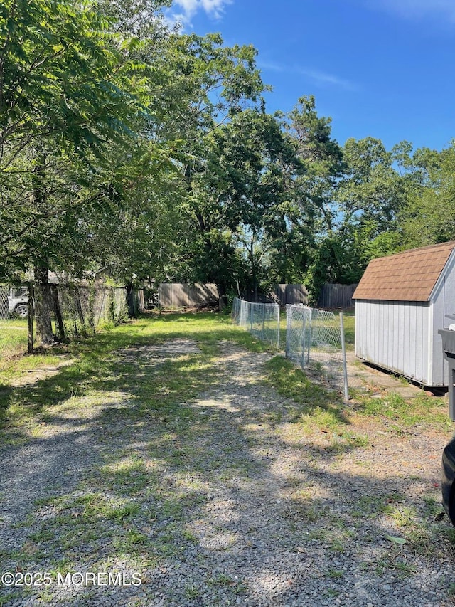 67 Burnt Tavern Rd, Brick, NJ 08724 - view of yard featuring a shed
