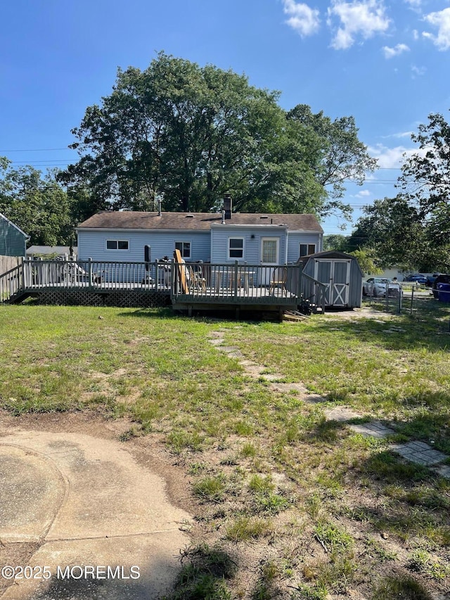 67 Burnt Tavern Rd, Brick, NJ 08724 - back of property with a storage unit and a wooden deck