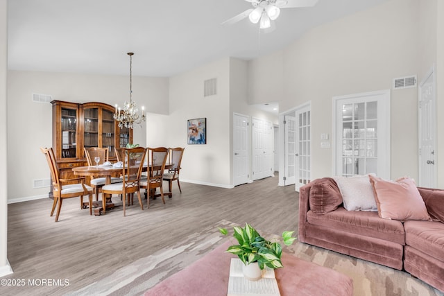 982 Thornbury Ln Unit B, Manchester, NJ 08759 - living area featuring high vaulted ceiling, wood finished floors, a ceiling fan, and a chandelier