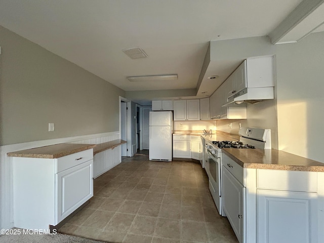 58 W Anchor Dr, Little Egg Harbor, NJ 08087 - kitchen with white appliances, under cabinet range hood, and white cabinetry