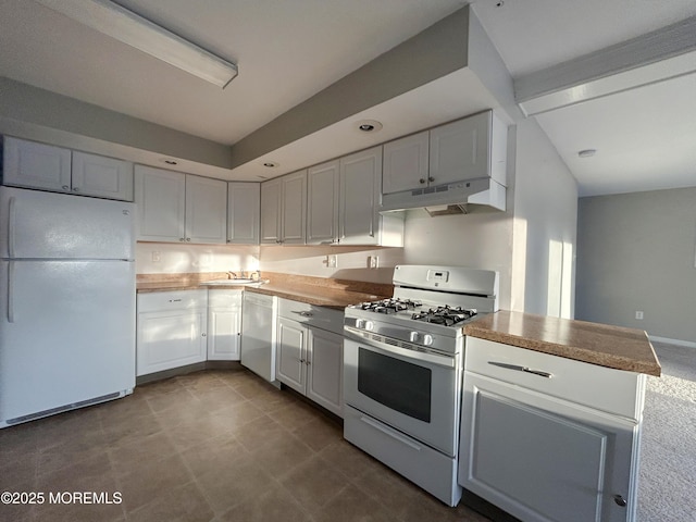58 W Anchor Dr, Little Egg Harbor, NJ 08087 - kitchen with white appliances, under cabinet range hood, white cabinets, and beamed ceiling