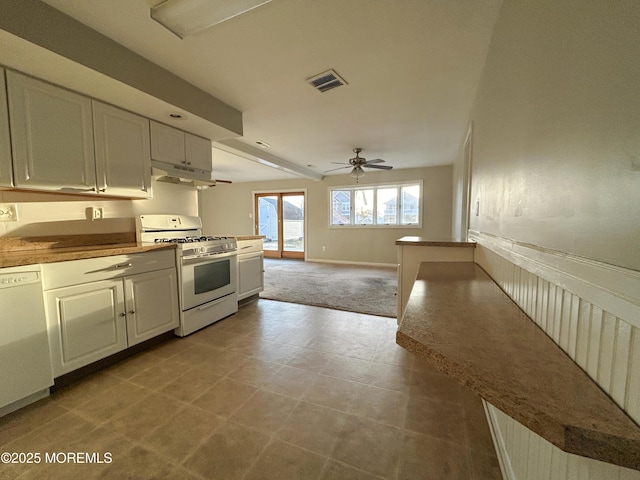 58 W Anchor Dr, Little Egg Harbor, NJ 08087 - kitchen featuring white appliances, a ceiling fan, under cabinet range hood, light colored carpet, and white cabinets