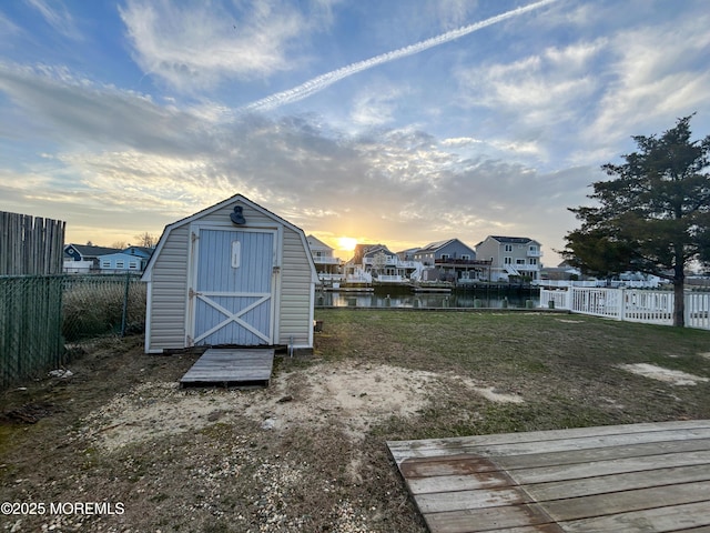 58 W Anchor Dr, Little Egg Harbor, NJ 08087 - yard at dusk with a storage unit and a water view