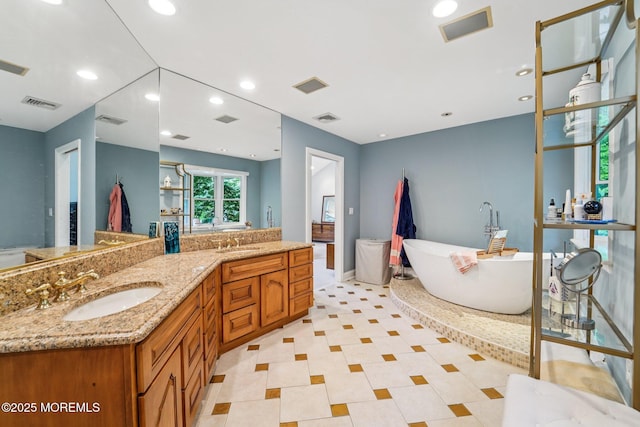 11 Delwood Rd, Chester Twp, NJ 07930 - full bathroom with a freestanding tub, double vanity, and recessed lighting