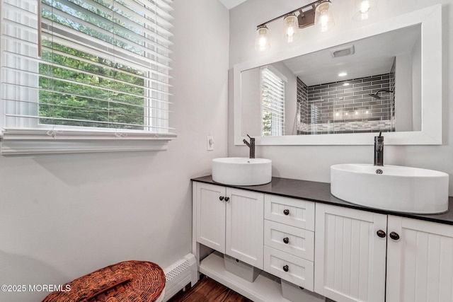 11 Delwood Rd, Chester Twp, NJ 07930 - full bath with double vanity, healthy amount of natural light, a tile shower, and a baseboard heating unit