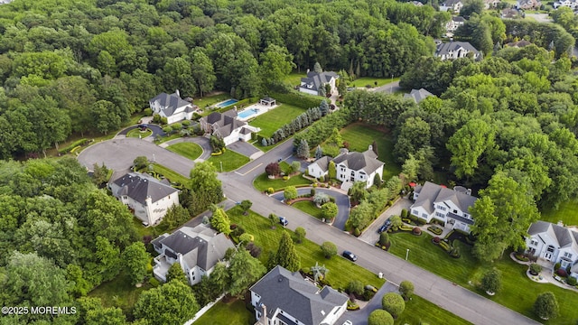 320 Sinclair Ct, Morganville, NJ 07751 - aerial view of property's location with nearby suburban area and a forest