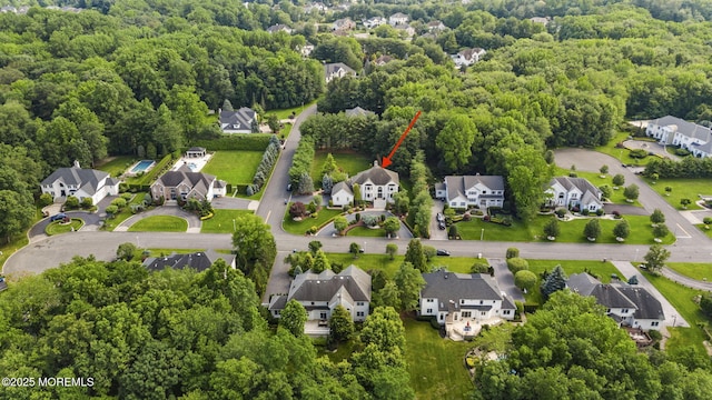 320 Sinclair Ct, Morganville, NJ 07751 - aerial perspective of suburban area with a forest