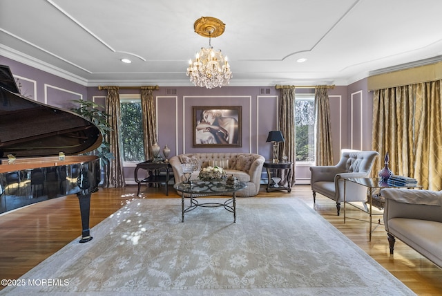 320 Sinclair Ct, Morganville, NJ 07751 - living room featuring ornamental molding, healthy amount of natural light, a chandelier, wood finished floors, and recessed lighting